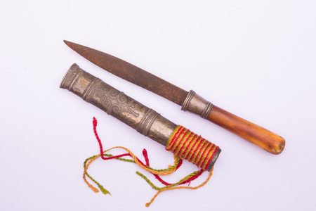 ancient dagger knife with case isolated on whiteの写真素材