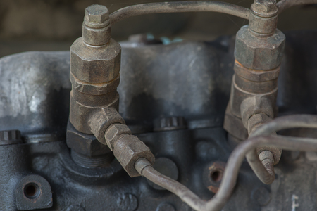 Close up of leaked engine oil on old machine