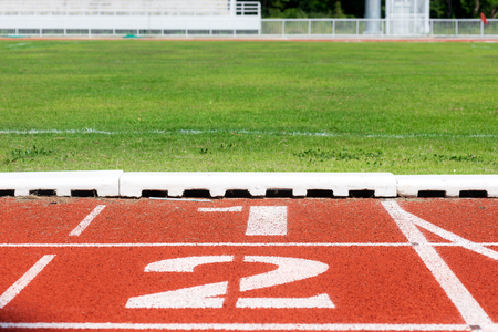 Close up of Running track pattern background in stadium.