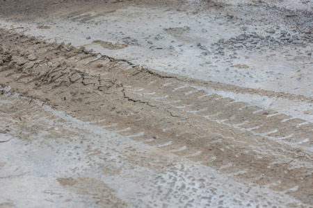 Wheel car track on wet cement concrete floor for background