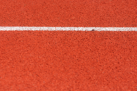 Close up of Running track pattern background in stadium.の写真素材