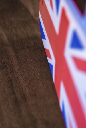 Union Jack flag speaker grill sat on a wooden tableの写真素材