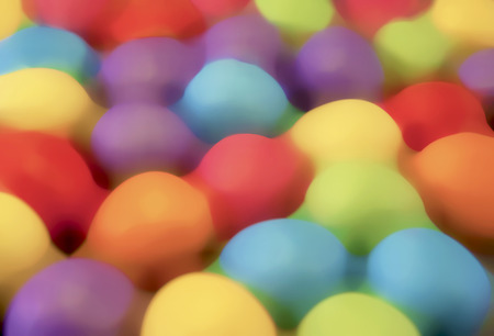 Illustration of easter mini eggs laying on a slate table, created using median noise reduction,の写真素材
