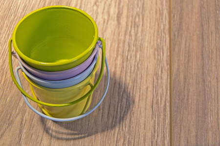 Egg cups shown lying on a wooden の写真素材
