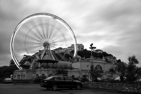 Torquay, Devon, UK, JUNE 7 2015 - Showing a long exposure of a feris wheel in the center of Torquayのeditorial素材