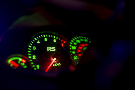 Newton abbot, Devon, UK Octoboer 16 2015 - Showing a ford focus steering wheel and parts of the instrument panel at night with illumination coming from various parts of the image.のeditorial素材