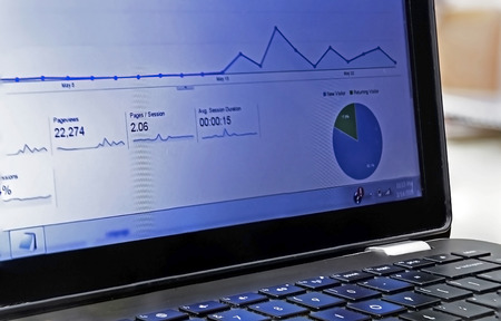 Showing a graph on a laptop screenの写真素材