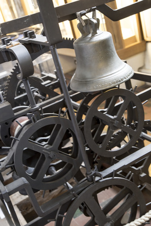 St Albans, London, UK, March 31st 2016 - Showing the Wallingford sun dial, bell and gears of the wallingford clock from the 14th century, sat in place at St Albans Cathedral. The clock could predict lunar eclispes as well as telling the timeのeditorial素材