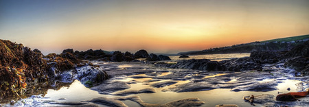 Sunset amongst the rock at bantham beach in South Devonの写真素材
