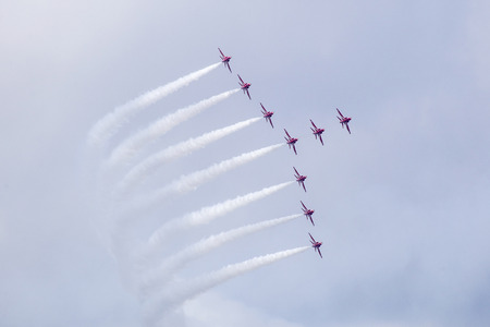 Torquay, Devon, UK, 12 June 2016 Showing the various formations of the RAF Red Arrows air display at the Torquay airshow, shot from public land during an overcast dayのeditorial素材