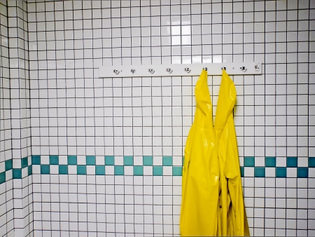 Yellow Work Aprons Hand on Rackの写真素材