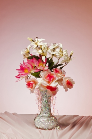 A bouquet of flowers against a colorful background の写真素材