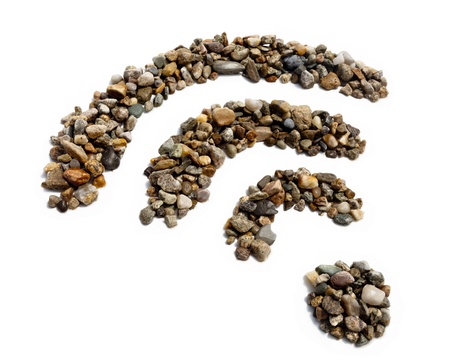 A wifi symbol made of stones against a white background の写真素材