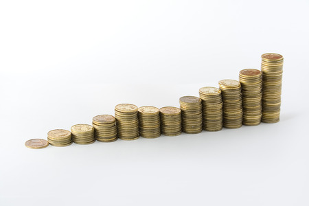 Rising stacks of coins on a white background.