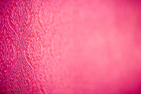 Red drapery with stylised pattern. Perspective view with small depth of view.