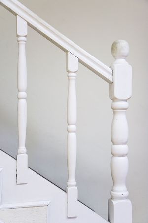 Old wooden stairs with baluster  white painted.の写真素材