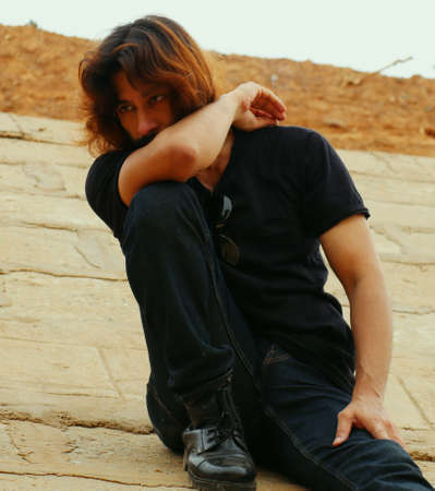 Street Fashion of stylish Long hair with beard man in a isolated placeの写真素材