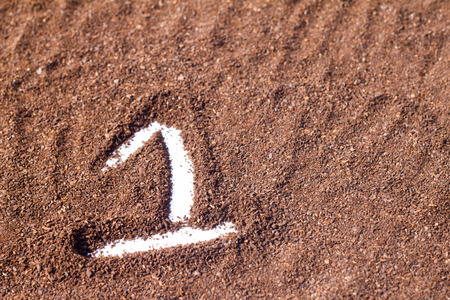 one number draw on cocoa powder, white backgroundの写真素材