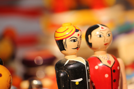 beautiful couple clay dolls in colorful attiresの写真素材