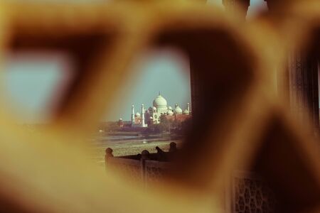 View of Taj Mahal from lattice jali in Agra, Uttar Pradesh, India. retry style effectの写真素材