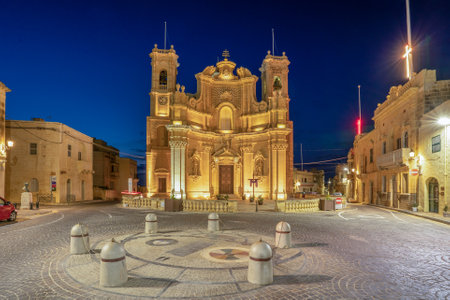 Gharb Parish Church and main square lit at nightの写真素材