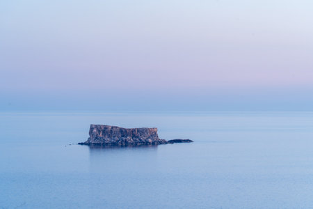 Filfla Island at Blue Hour under a Tranquil Skyの写真素材
