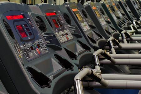 Row of treadmills in the gymの写真素材