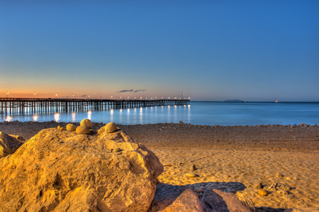 Pre dawn glow in the sky behind the stacked rocks.の写真素材