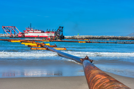Pipeline for moving the sand and silt from Ventura Harbor.の写真素材