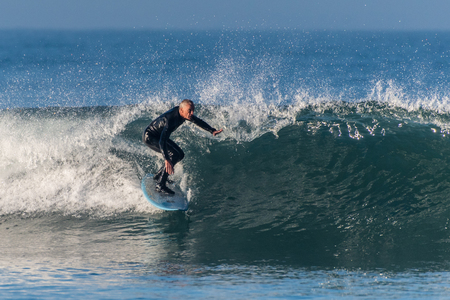 Baby Boomer male surfer dropping into a clean wave pushed by Hurricane Rosa at Ventura's Surfers Knoll on September 30, 2018 in California.のeditorial素材
