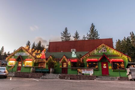 Evergreen Cafe and Racoon Saloon decorated in Christmas holiday lights on Evergreen Rd in Wrightwood, California, USA on December 28, 2018.のeditorial素材