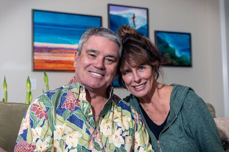 Dennis and Claire Jenks happy to be moved back into their new home seated with heads touching in living room on December 11, 2019 in Ventura, California, USA.のeditorial素材