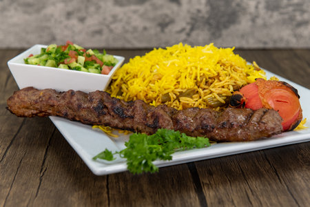 Slow roasted zeresch polo chicken with basmati rice and chopped fruit.の写真素材