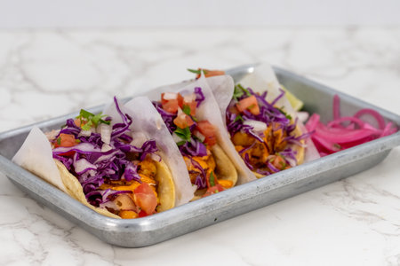 Latino food for a hungry patron includes a trio of beer batter fish tacos.の写真素材