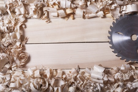 Construction tools on wooden table with sawdust. Joiner carpenter workplace top view. Copy space for text.の写真素材