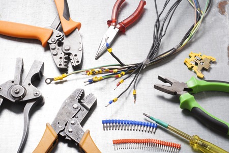 Set of electrical tool on wooden background.の写真素材