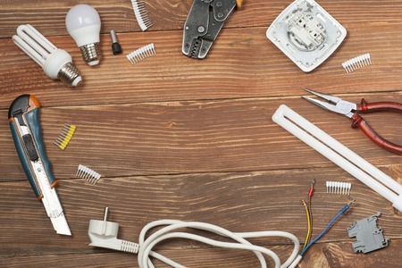 Set of electrical tool on wooden background.の写真素材