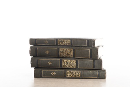 Stack of books on white background.