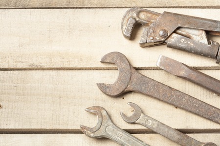 Set of construction tools. Wrench on wooden background.の写真素材