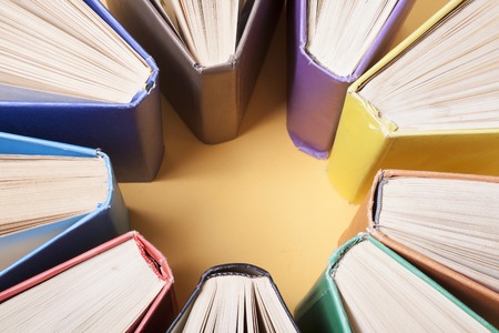 Open book, hardback books on wooden table. Education background. Back to school. Copy space for textの写真素材