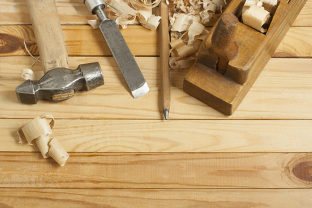 Carpentry concept.Joiner carpenter workplace. Construction tools on wooden table with sawdust.の写真素材