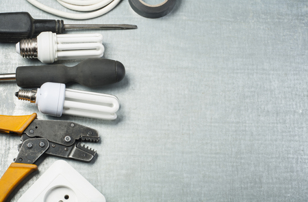 Set of electrical tools on metallic background. Energy concept.Copy space for text.