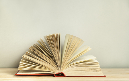 Open book on wooden table. Education background. Back to school. Free copy space.の写真素材