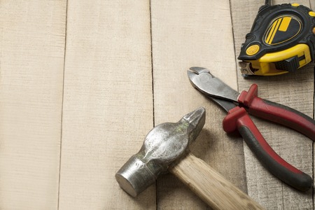 Construction tools on wooden background.Copy space for text.