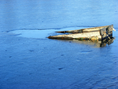 Boat under the thin iceの写真素材