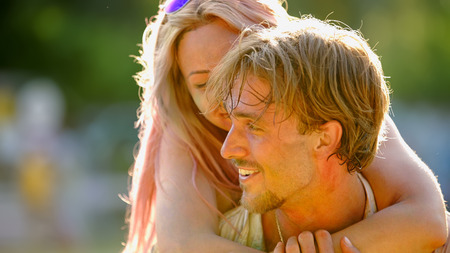 Man carrying girlfriend on back, beautiful romantic couple, tender relationsの写真素材