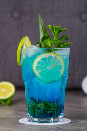 Blue Mojito with lemon, mint and ice, fresh summer drinkの写真素材