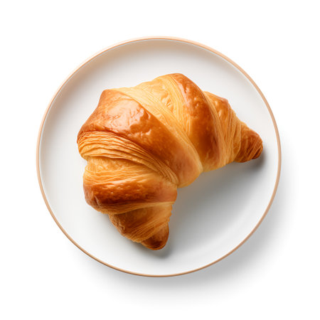 Croissant on plate isolated on white backgroundの素材
