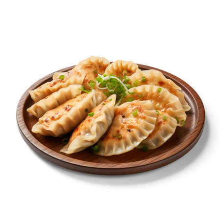 Gyoza on plate isolated on white backgroundの素材