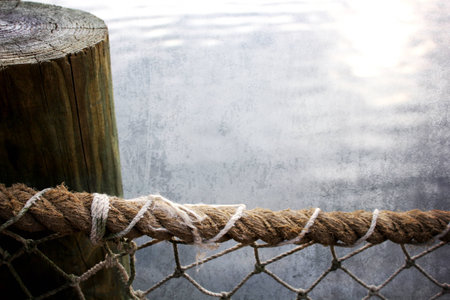 rope fence at dockの写真素材